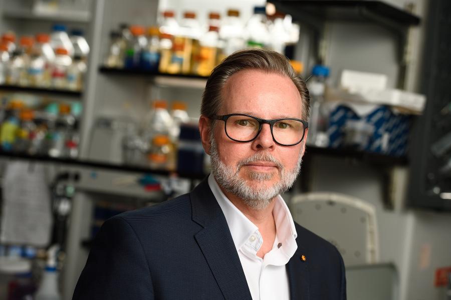Portrait of JHU researcher Jeff Coller in a lab setting